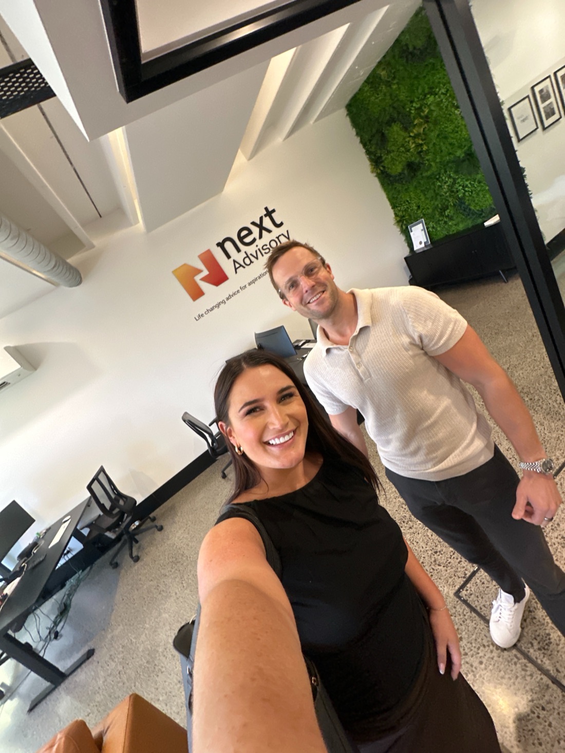 Roi with a client at their office